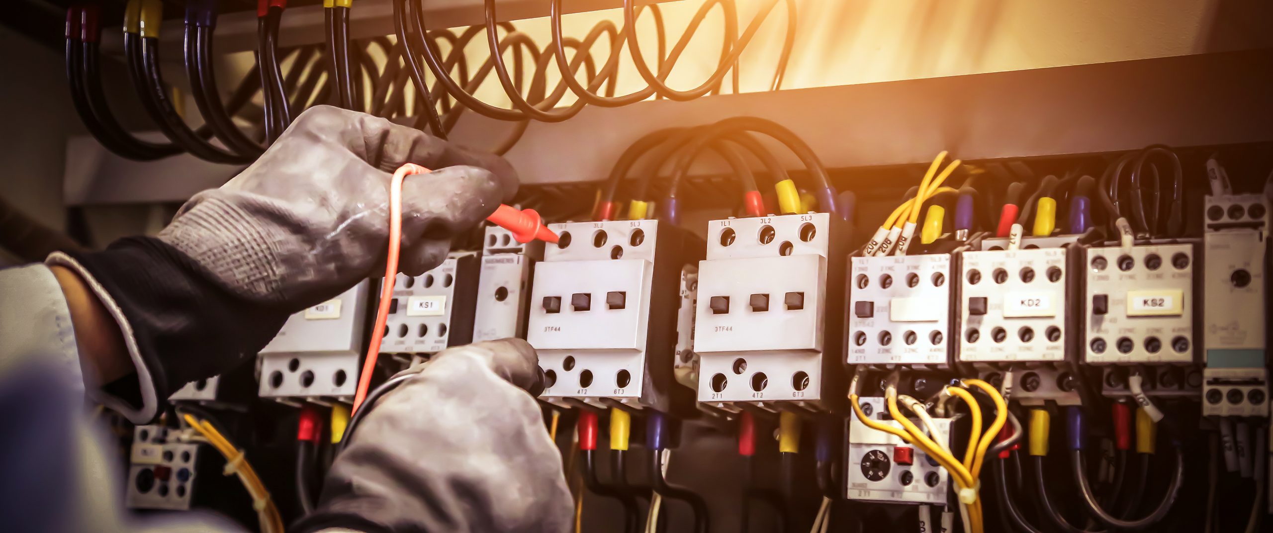 Close-up hand of electrical engineering using measuring to checking electricity.